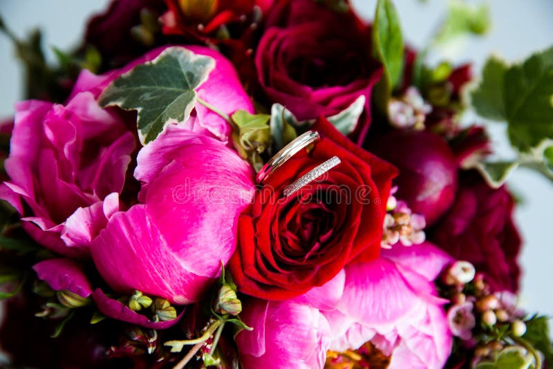 Wedding gold rings on a bouquet of flowers royalty free stock photo Wedding gold rings on a bouquet of flowers royalty free stock photo
