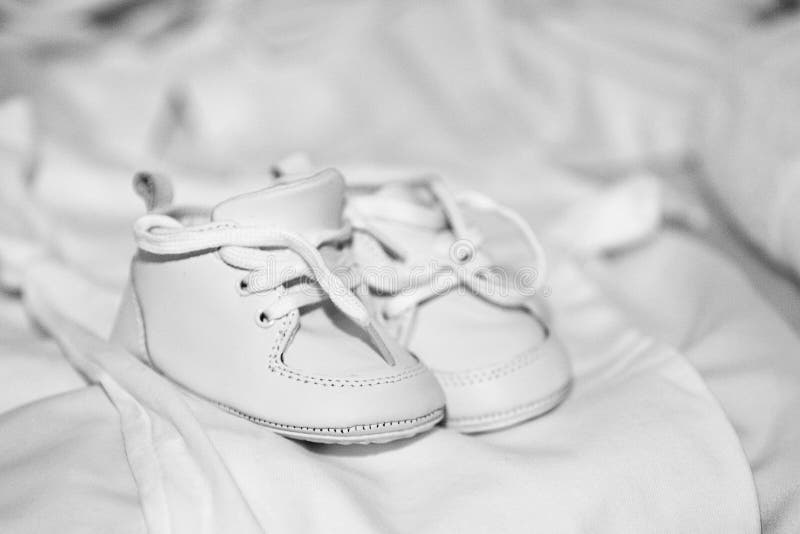 Pair of white baby shoes