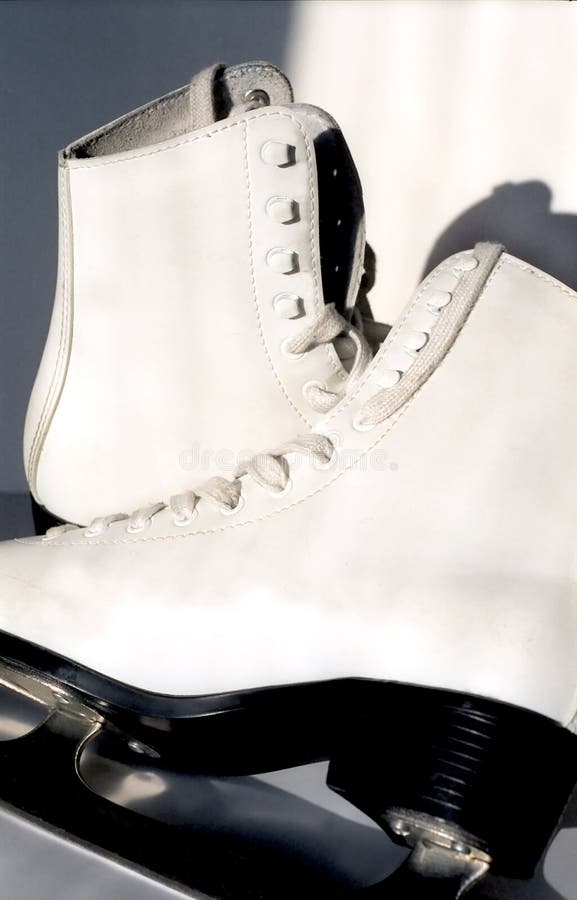 Pair of white ice skates stock photo. Image of heel, skating 8355478