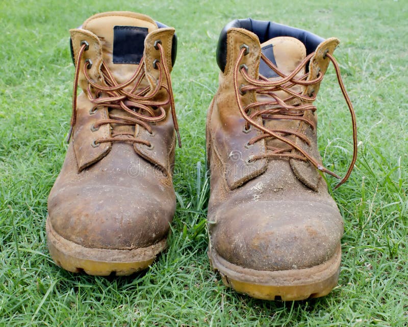 A Pair of Work Boots on Grass Stock Photo - Image of grass, green: 17210384