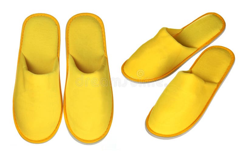 Pair of yellow house slippers stock images