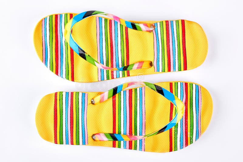 Pair of yellow striped flip flops. royalty free stock images Pair of yellow striped flip flops. royalty free stock images