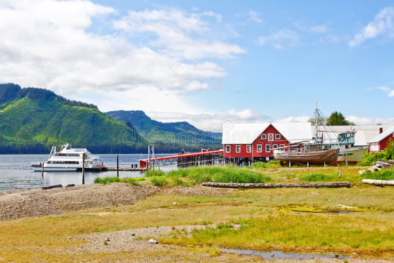 An onshore view of the rocky beach leading up to the Icy Strait Point old historic cannery and cruise ship visitors center near Hoonah, Alaska on Chichagof Island. The larger boat is boarding people for a whale watching trip in Icy Strait and nearby Point Adolphus. Icy Strait Point itself is owned by local native Tlingit tribe members, and Hoonah is the largest Tlingit community in the Pacific Northwest. An onshore view of the rocky beach leading up to the Icy Strait Point old historic cannery and cruise ship visitors center near Hoonah, Alaska on Chichagof Island. The larger boat is boarding people for a whale watching trip in Icy Strait and nearby Point Adolphus. Icy Strait Point itself is owned by local native Tlingit tribe members, and Hoonah is the largest Tlingit community in the Pacific Northwest.