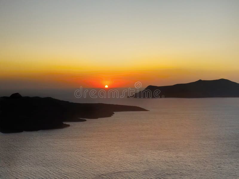 Magical sunset scenery. View from Santorini island. Magical sunset scenery. View from Santorini island.