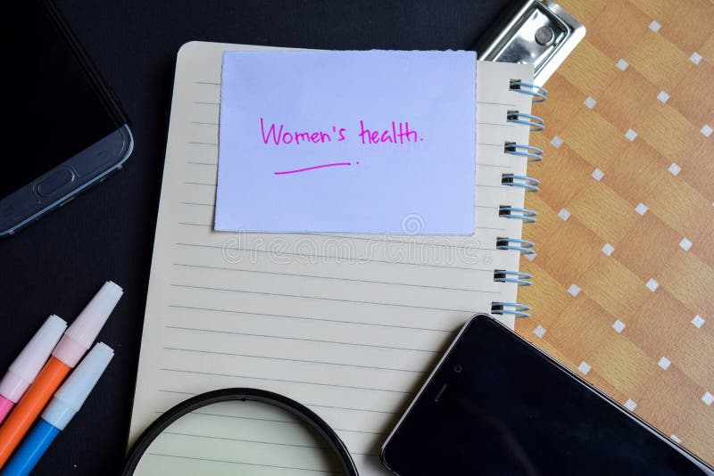 Palabra de la salud del ` s de las mujeres escrita en el papel Texto en el libro de trabajo, concepto de la salud del ` s de las fotografía de archivo Palabra de la salud del ` s de las mujeres escrita en el papel Texto en el libro de trabajo, concepto de la salud del ` s de las fotografía de archivo