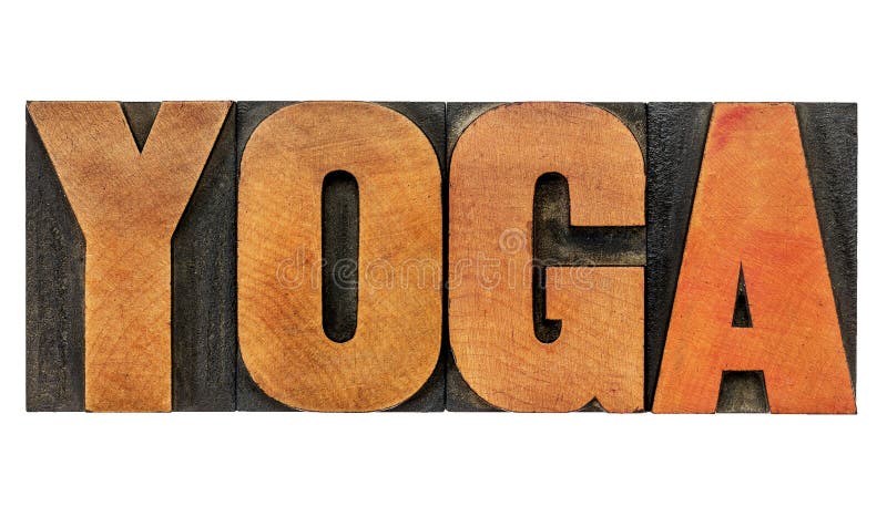 Palabra de la yoga en el tipo de madera foto de archivo Palabra de la yoga en el tipo de madera foto de archivo