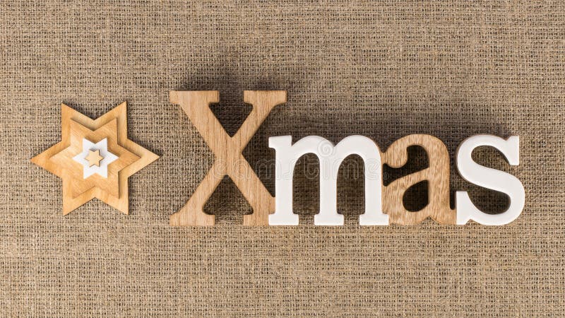 Palabra de Navidad con las estrellas decorativas foto de archivo Palabra de Navidad con las estrellas decorativas foto de archivo