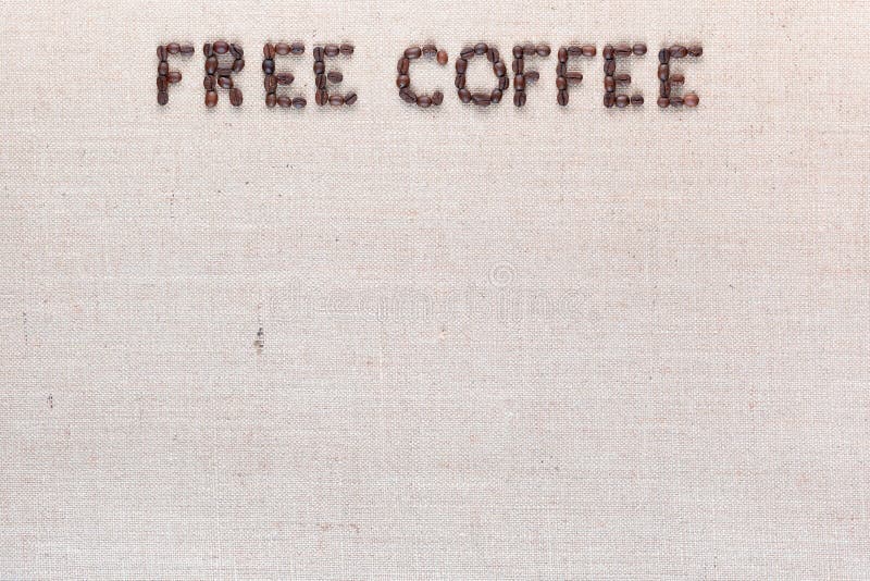 Palabras libres del café hechas de los granos de café en la lona de lino, centro superior dispuesto imágenes de archivo libres de regalías Palabras libres del café hechas de los granos de café en la lona de lino, centro superior dispuesto imágenes de archivo libres de regalías