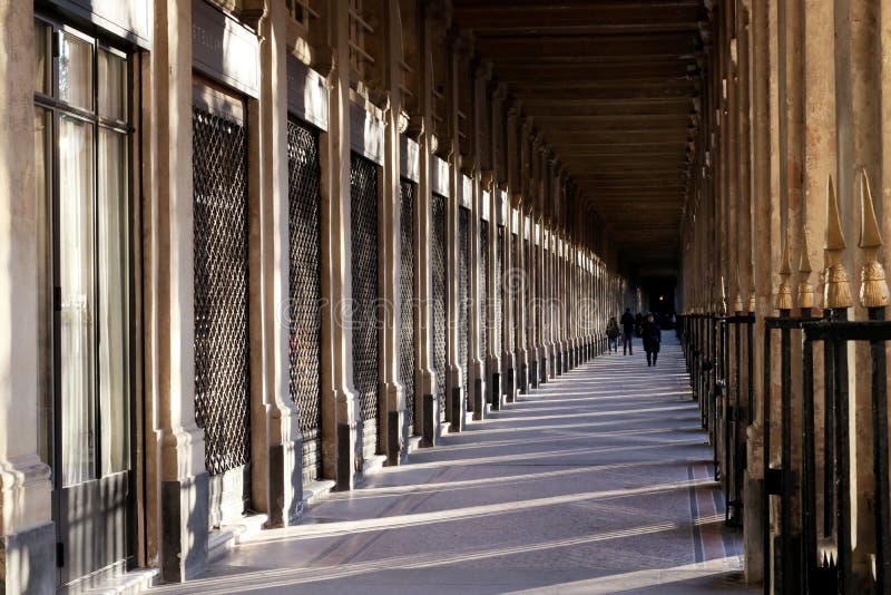 The romantic appeal of the Palais-Royal a quiet retreat in the center located in the 1st arrondissement France. The entrance faces the Louvre Palace and houses the Council of State, the Constitutional Council, and the Ministry of Culture. Pillar column garden stock images, royalty-free photos and pictures
