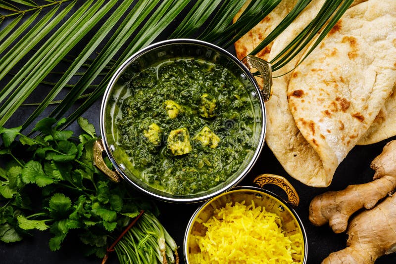Palak Paneer indian food with cheese and spinach, Naan bread and Basmati Rice with Saffron stock images Palak Paneer indian food with cheese and spinach, Naan bread and Basmati Rice with Saffron stock images