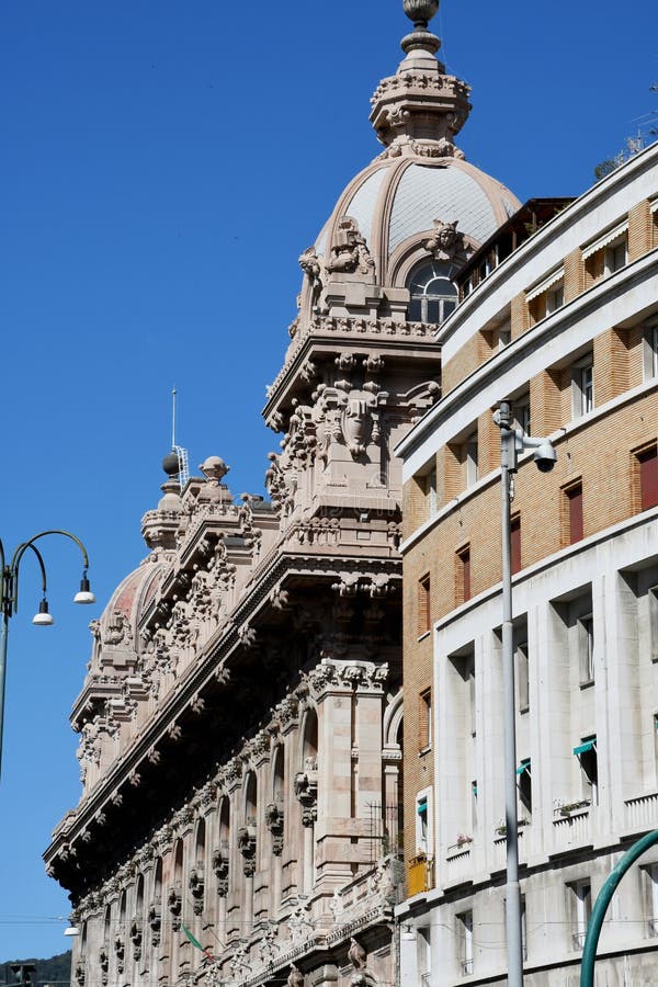 Palazzo della Borsa, Piazza Dante by Piazza de Ferrari, Genoa, Italy.   
Genoa or Genova is a port city and the capital of the Liguria region of Italy. In the old town stands the Romanesque Cathedral of San Lorenzo, with its black and white striped facade. Narrow lanes open onto monumental squares like Piazza de Ferrari, site of an iconic bronze fountain. Palazzo della Borsa, Piazza Dante by Piazza de Ferrari, Genoa, Italy.   
Genoa or Genova is a port city and the capital of the Liguria region of Italy. In the old town stands the Romanesque Cathedral of San Lorenzo, with its black and white striped facade. Narrow lanes open onto monumental squares like Piazza de Ferrari, site of an iconic bronze fountain.