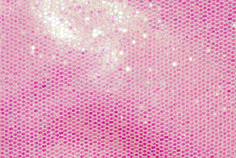 Pale pink sequin fabric background. Pale pink sequin fabric background