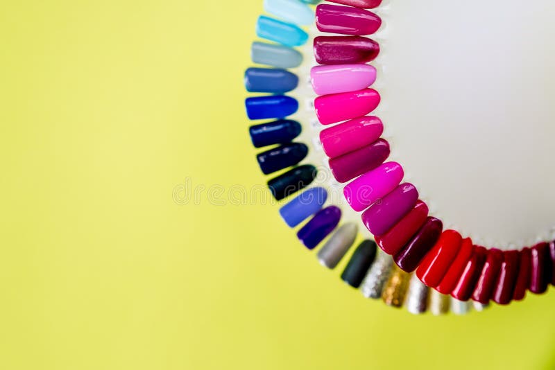 Palette with swatches of nail Polish. a collection of samples of varnish for manicure. trendy colorful various manicure stock photo Palette with swatches of nail Polish. a collection of samples of varnish for manicure. trendy colorful various manicure stock photo