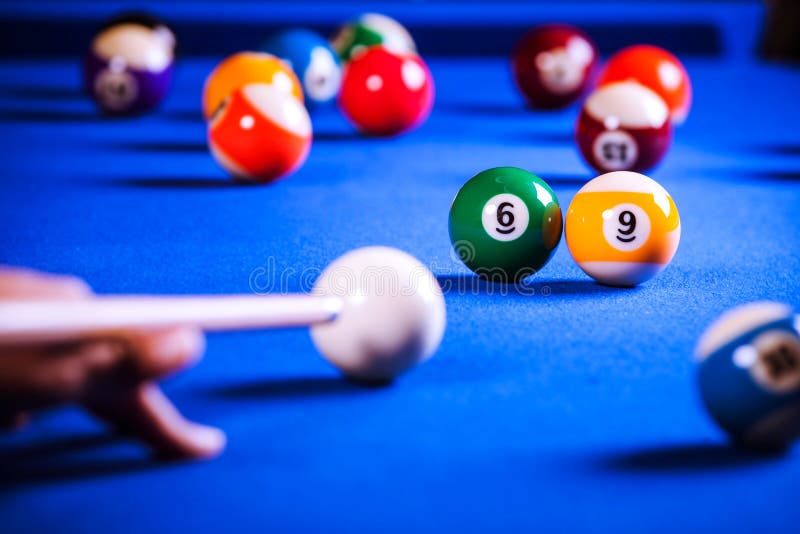 Billiard balls in a blue pool table. Billiard balls in a blue pool table