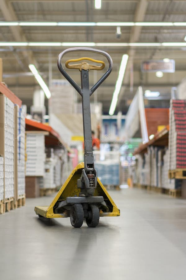 pallet jack in a building store. Manual pallet jack in supermarket royalty free stock image pallet jack in a building store. Manual pallet jack in supermarket royalty free stock image