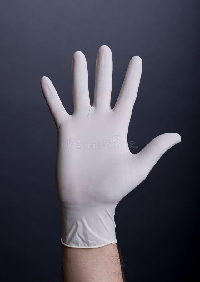 Palm in latex handschoen stock fotografie