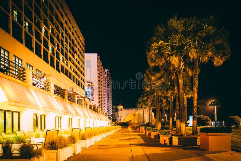 Palm trees and hotels at night, in Daytona Beach, Florida.