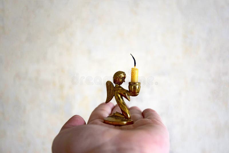 On the palm of a woman`s hand the extinguished church candle stock images On the palm of a woman`s hand the extinguished church candle stock images