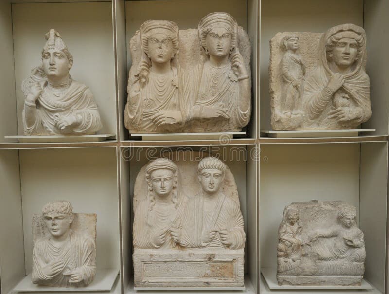 Palmyrene funerary relief busts were first produced in Palmyra in the middle of the first century BC. The reliefs were carved into square pieces of limestone and depicted figures in a direct frontal pose cut off at mid-torso. Arms and hands were portrayed in various gestures and poses. Most busts display a solitary figure, however some sculptures incorporate multiple figures of family members. Names and lineage of the deceased are engraved in Aramaic above the shoulders, and in some cases, with Greek . Palmyrene funerary relief busts were first produced in Palmyra in the middle of the first century BC. The reliefs were carved into square pieces of limestone and depicted figures in a direct frontal pose cut off at mid-torso. Arms and hands were portrayed in various gestures and poses. Most busts display a solitary figure, however some sculptures incorporate multiple figures of family members. Names and lineage of the deceased are engraved in Aramaic above the shoulders, and in some cases, with Greek .