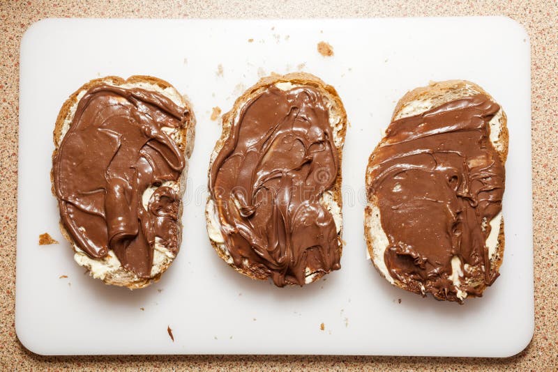 Closeup of a slices of bread with chocolate cream. Closeup of a slices of bread with chocolate cream