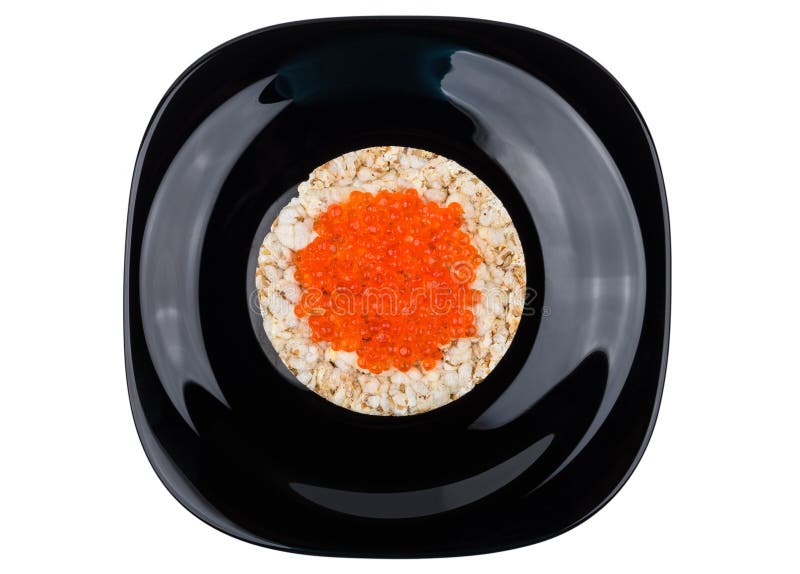 Pan de maíz curruscante con el caviar rojo en placa negra fotos de archivo libres de regalías Pan de maíz curruscante con el caviar rojo en placa negra fotos de archivo libres de regalías