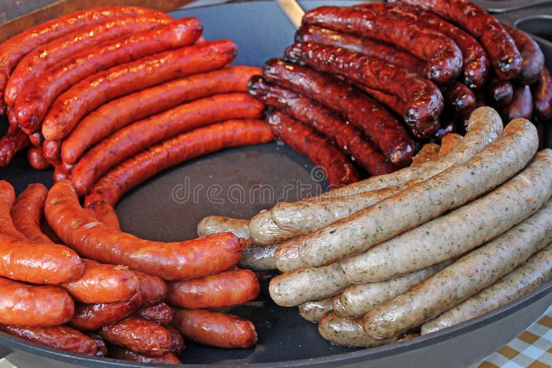 Pan with fried pork sausages on traditional czech market. Czech street food. Pan with fried pork sausages on traditional czech market. Czech street food.