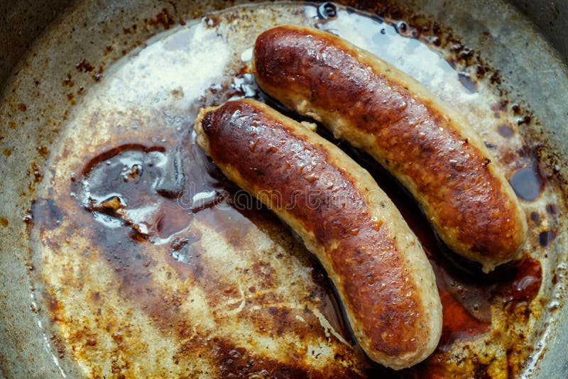 Pan fried sausage stock image. Image of golden, grilled 70303863