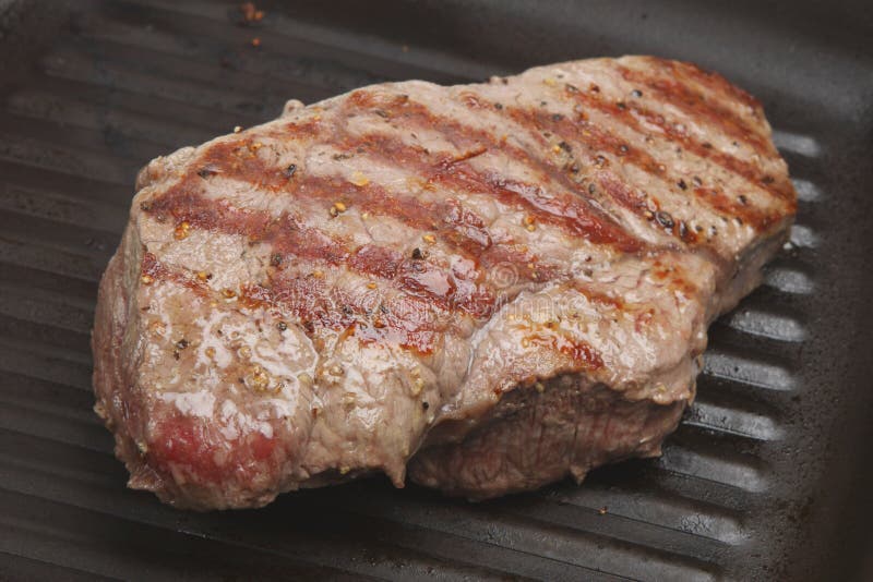 RibEye Steak Cooking on Griddle Stock Photo Image of grill, blood