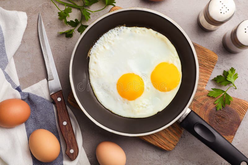 Pan with Fried Sunny Side Up Eggs Served on Table Stock Photo Image