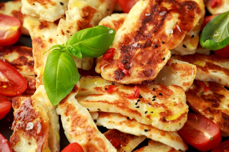 Panseared Halloumi Cheese and Sweet Cherry Tomatoes Salad Stock Photo