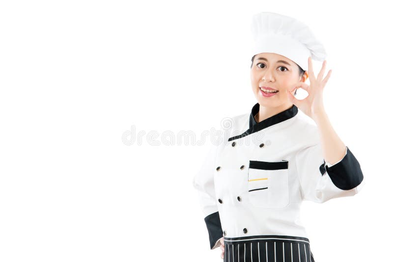 Panadero o cocinero del cocinero que muestra la muestra aceptable de la mano imagen de archivo libre de regalías Panadero o cocinero del cocinero que muestra la muestra aceptable de la mano imagen de archivo libre de regalías