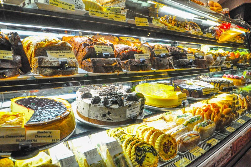 A Cakes and sweets bakery in pastry shop glass display. A Cakes and sweets bakery in pastry shop glass display.