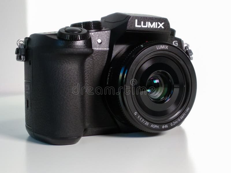 Panasonic Lumix G80 / G85 Micro Four Thirds mirrorless digital camera on white desk with 20mm F1.7 lens.