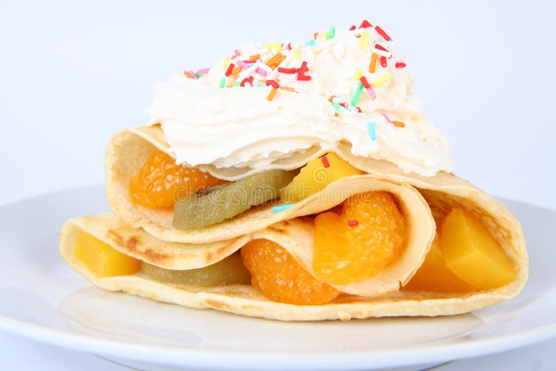 Pancake with fruit and whipped cream