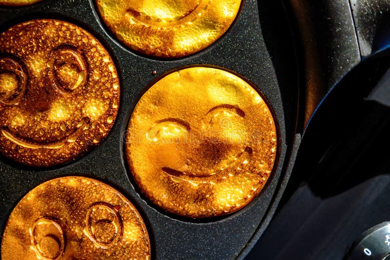 Pancake Frying Pan with Smile Face Pancake Cooking on Cooker in Kitchen