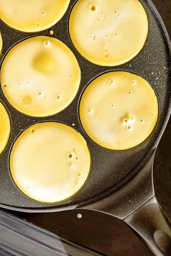Pancake Frying Pan with Smile Face Pancake Cooking on Cooker in Kitchen