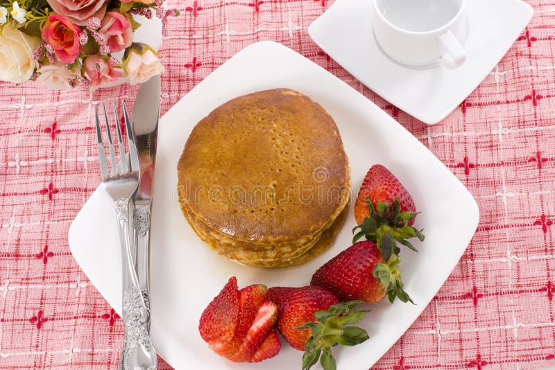 Pancake maple syrup on top with coffee