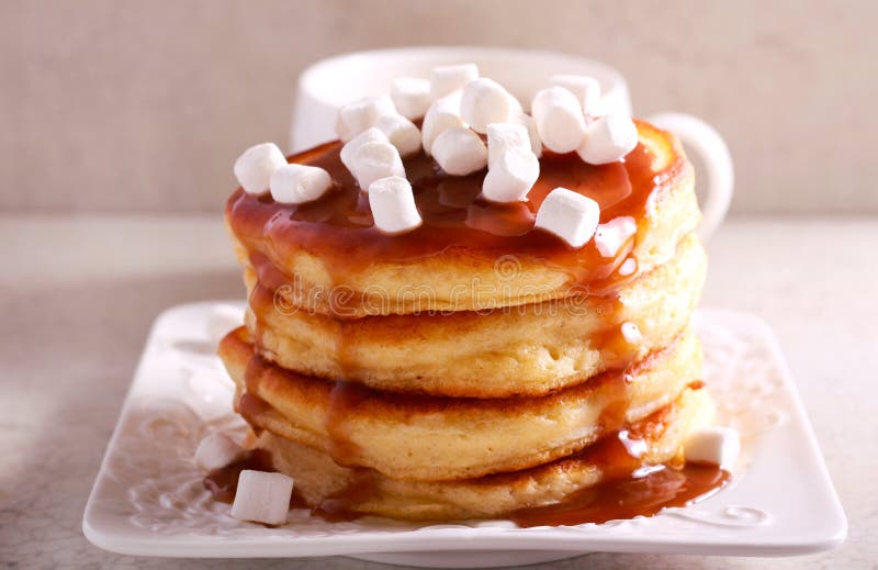 Pancakes with caramel sauce and marshmallow stock photo Pancakes with caramel sauce and marshmallow stock photo