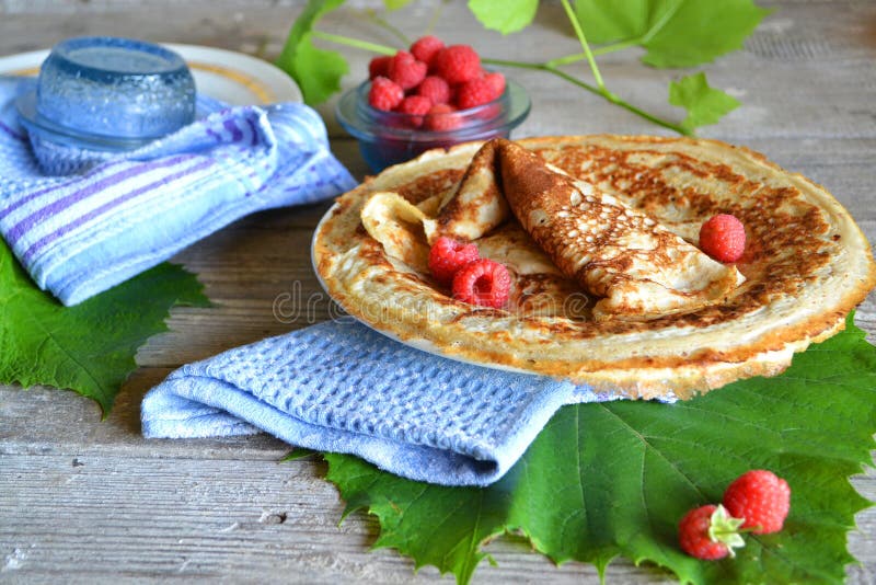 Pancakes with caramel sauce and raspberries. Gourmet food. Breakfast food table royalty free stock photo Pancakes with caramel sauce and raspberries. Gourmet food. Breakfast food table royalty free stock photo