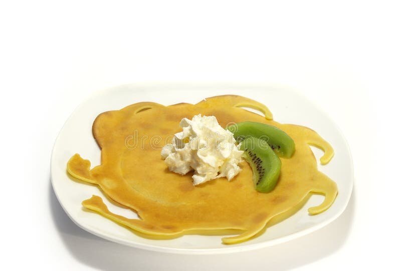 Pancakes filled with whipped cream and kiwi