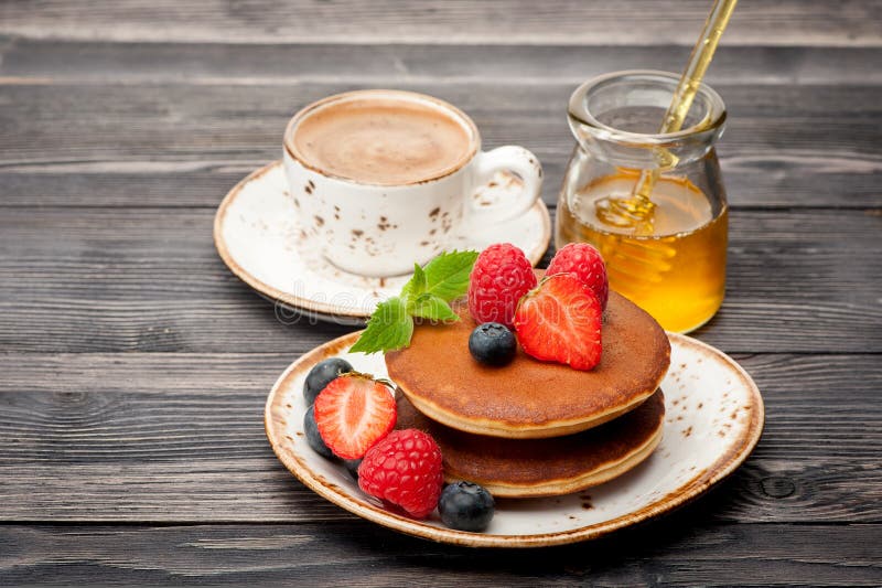 Pancakes, Honey, Berries And A Cup Of Coffee Espresso Stock Photo ...