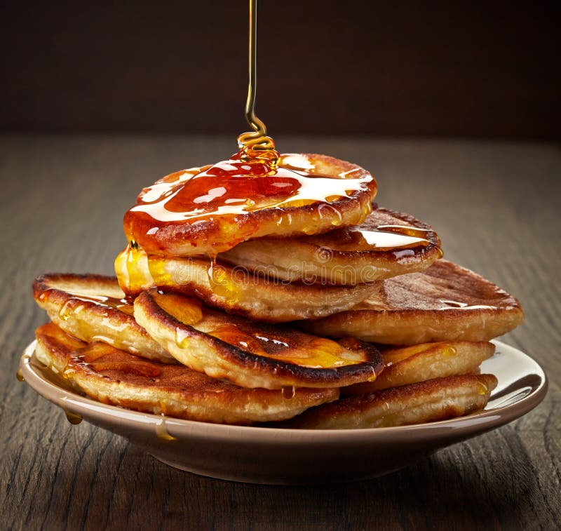 Pancakes with maple syrup stock photo