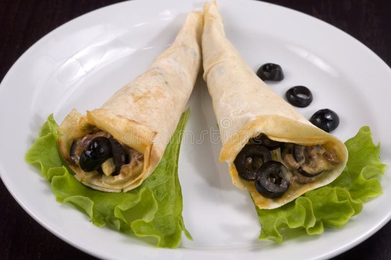 Pancakes with mushrooms and olives.