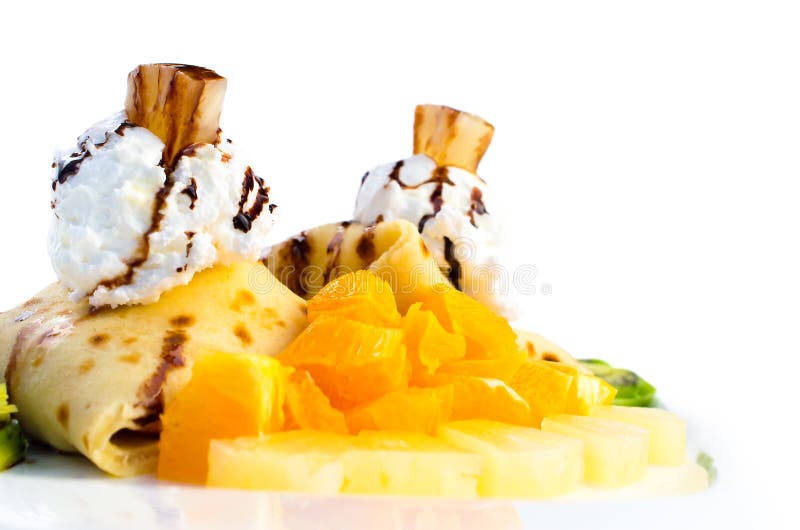 Pancakes with orange, kiwi and whipped isolated on white stock images