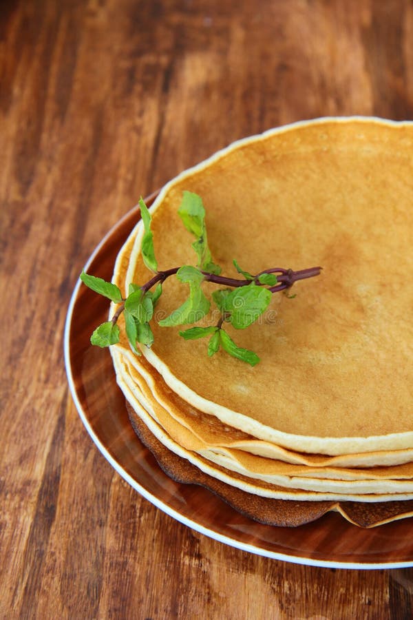 pancakes on a plate on a brown background