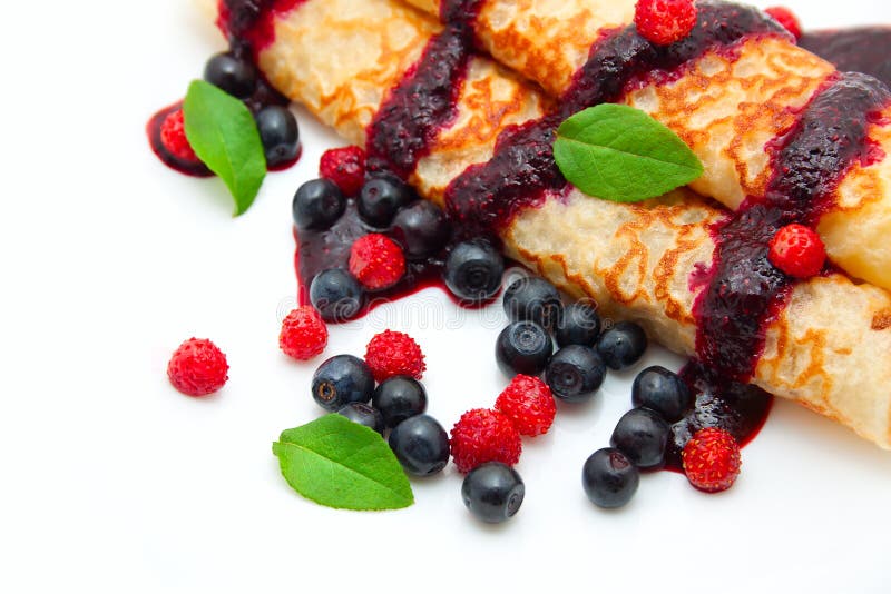 Pancakes rolled in a tube with berries