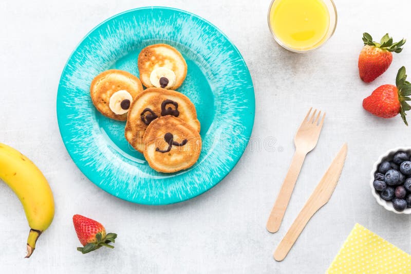 Pancakes in the Shape of a Bear for Kids, Served with Fruit and Juice