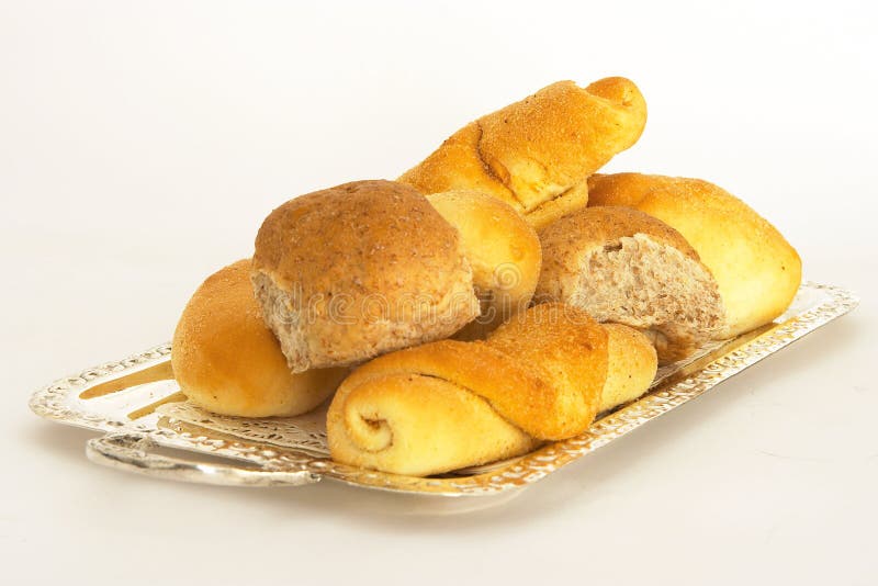 An assortment of bread rolls on a silver tray. An assortment of bread rolls on a silver tray