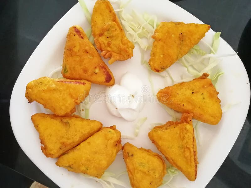 Paneer Cheese Fried in Batter is on a Platter with White Sauce Stock
