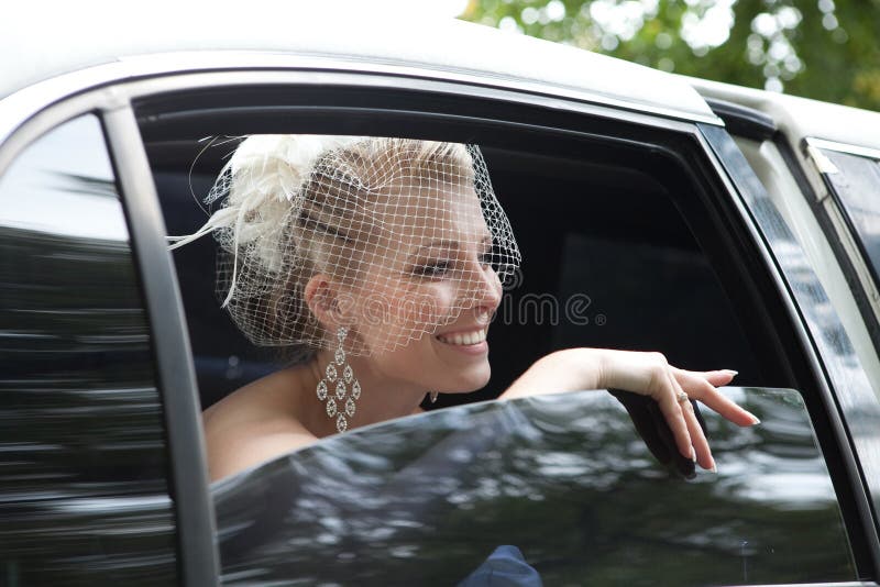 Outdoor shot,Bride in the car. Outdoor shot,Bride in the car